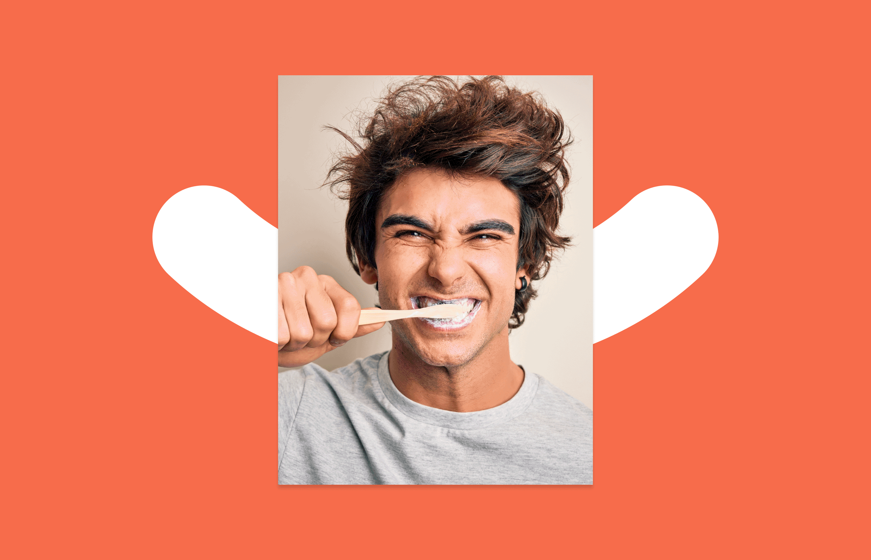 GIF of two alternating images. The first is of a man with brown hair and a gray sweater brushing his teeth. The man has a smile on his face. The second photo is of the same man with the toothbrush in a different place in his mouth. The alternation of the 