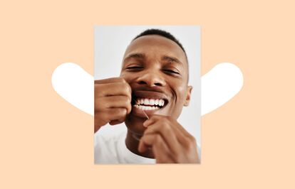 Image of a man flossing his teeth. The image is positioned on a pale orange background with a white hyphen with the ends curved upwards in the shape of a smile.